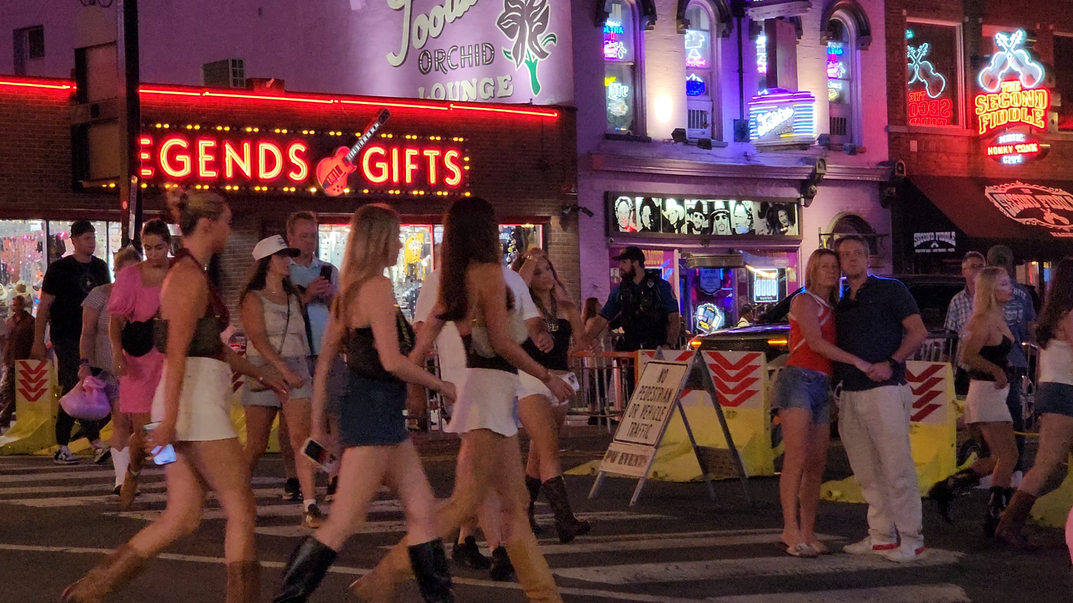A dense late-night crowd on Lower Broadway in downtown Nashville.