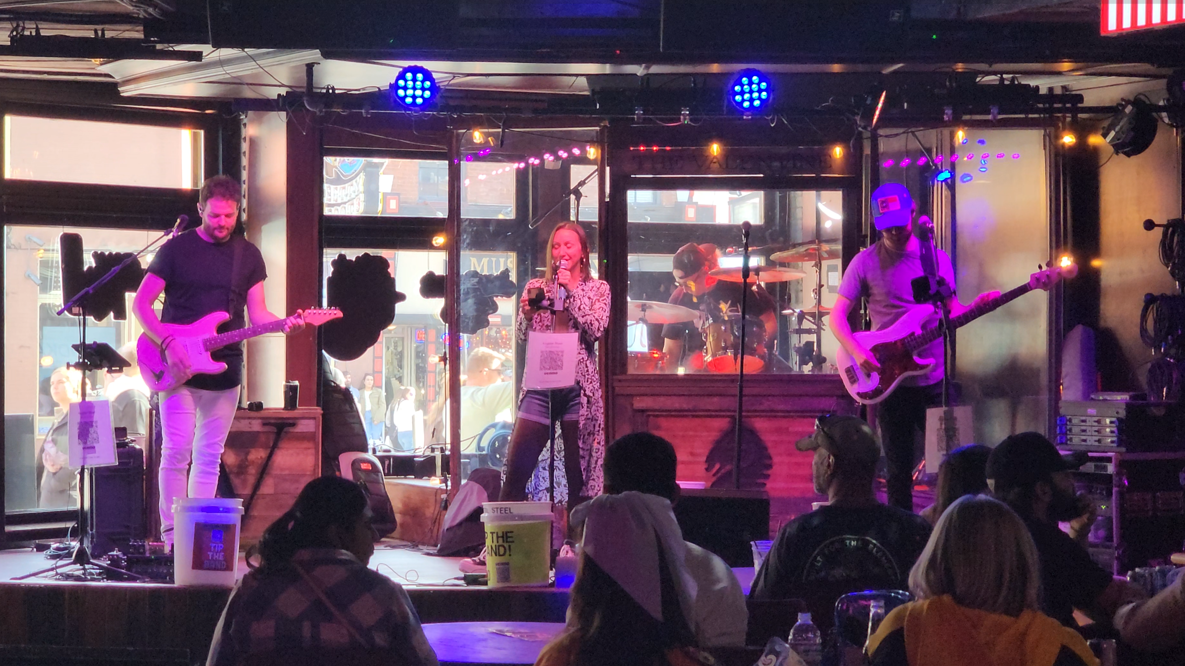 A full band performs inside a Lower Broadway venue.